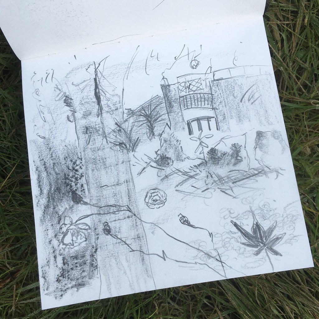 A sketch on a page showing rough outlines of trees, plants, and a building, with various textures and shading in pencil.