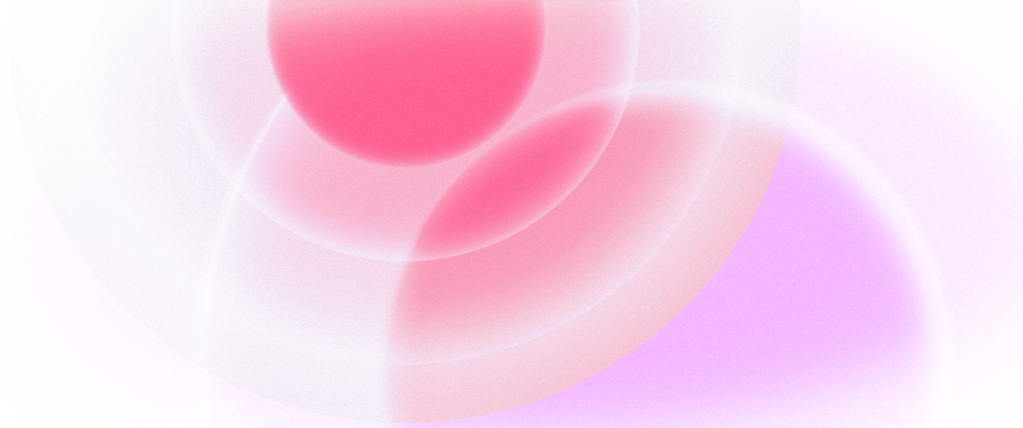 An abstract design featuring overlapping soft circles in shades of pink and purple, with a gradient effect that creates a smooth and ethereal appearance.