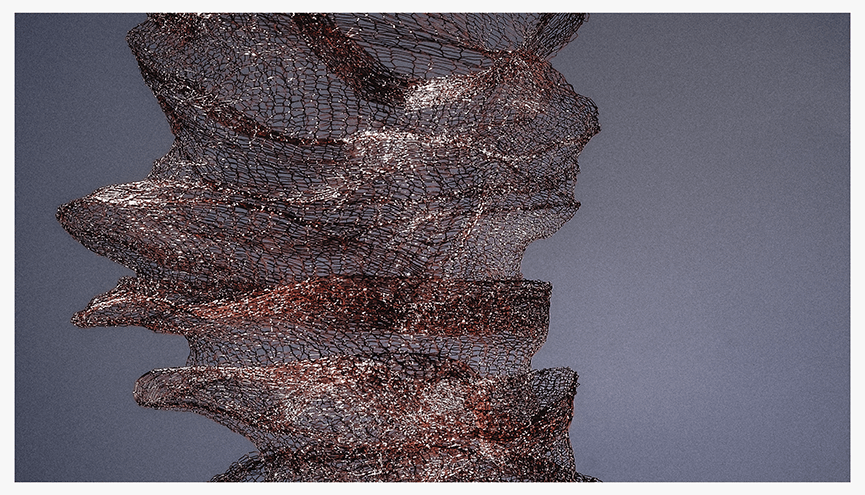 A close-up photograph of a sculptural piece made from delicate copper mesh, showcasing its intricate textures and forms against a gray background.