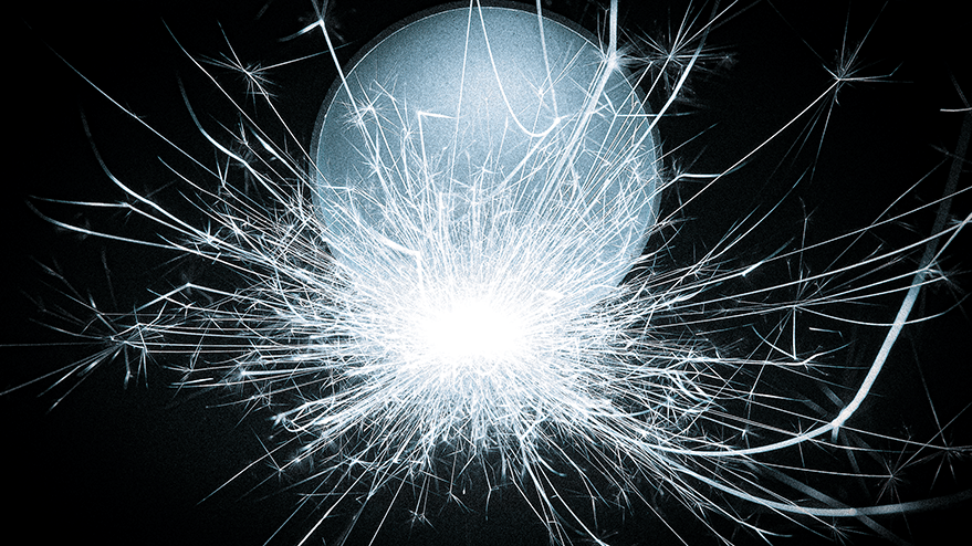 A steel ball emitting bright sparks against a dark background, evoking a dynamic and energetic atmosphere.