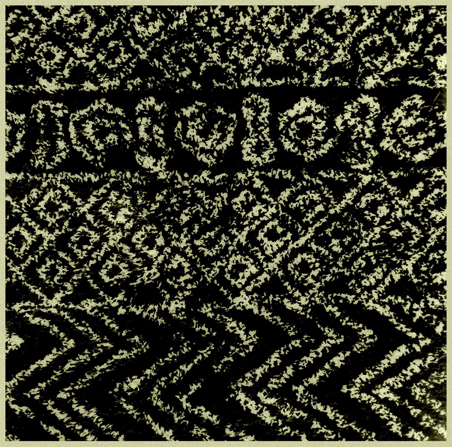 An abstract patterned textile design in black and light yellow, featuring intricate shapes and repetitive motifs.