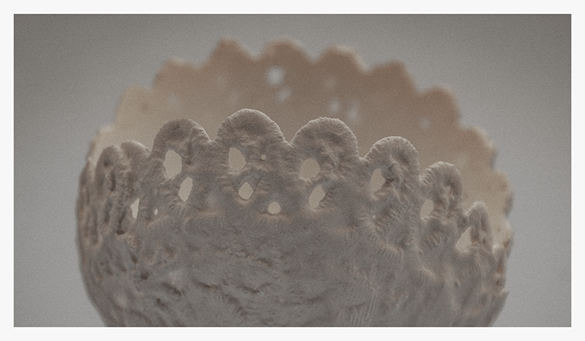 Close-up of a calcified artefact resembling a delicate lace doily, showcasing intricate patterns and textures.