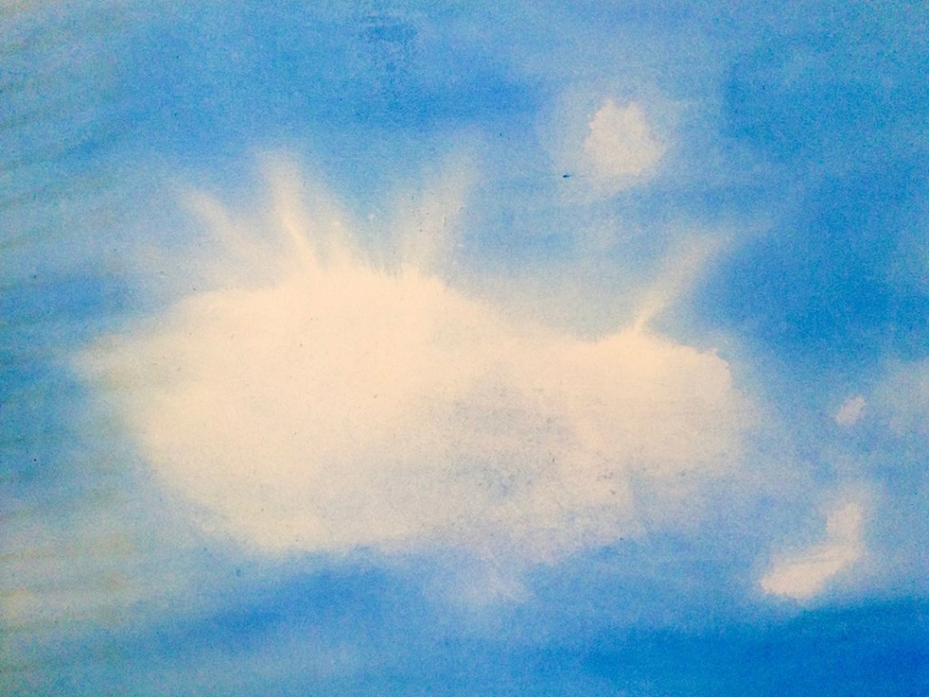 A blue sky background with a light, fluffy white cloud slightly off-center.