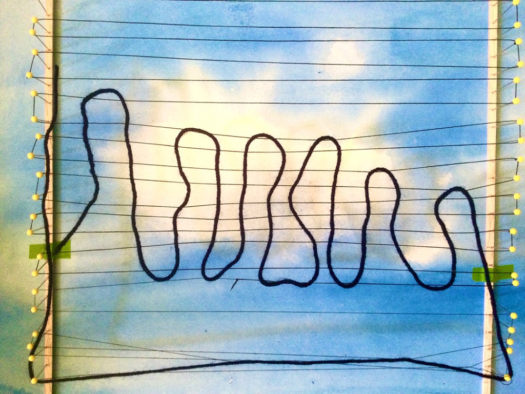 An abstract weaving design featuring black yarn arranged in a flowing pattern against a backdrop of a blue sky with clouds.